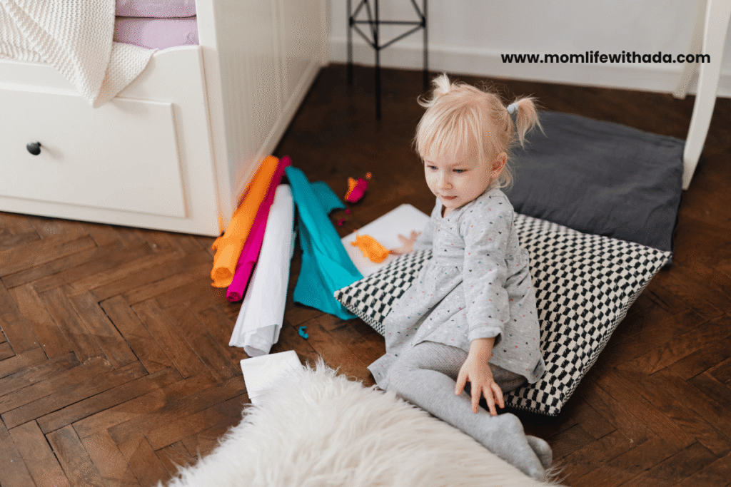 active toddler play ideas - toddler jumping on colorful floor spots indoors