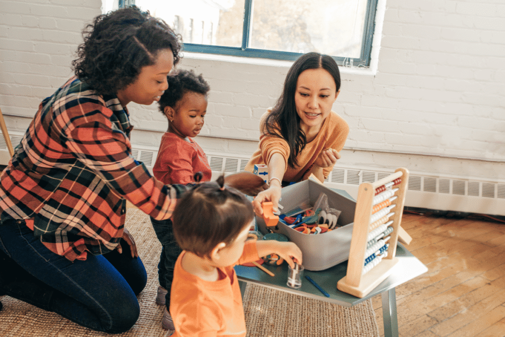 mom and kids doing easy DIY crafts for kids at home on the kitchen table