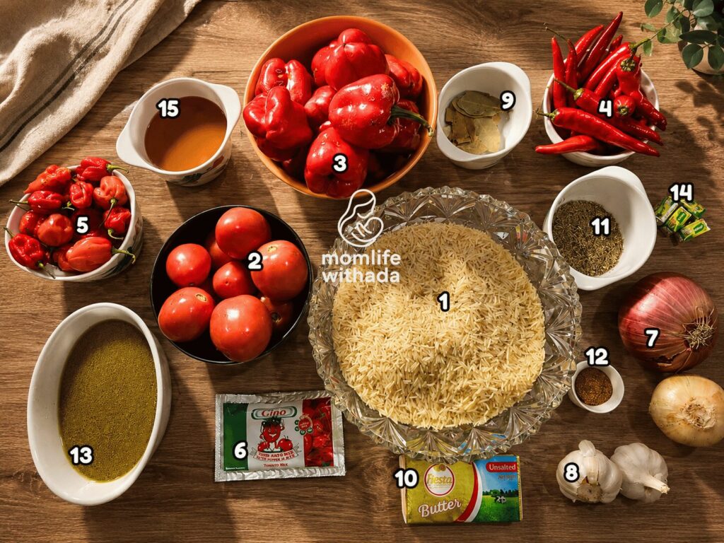 Flat lay of all ingredients for smoky Nigerian Jollof Rice including tomatoes, red bell peppers, habanero peppers, onions, long grain parboiled rice, chicken stock, and spices arranged on a white wooden surface