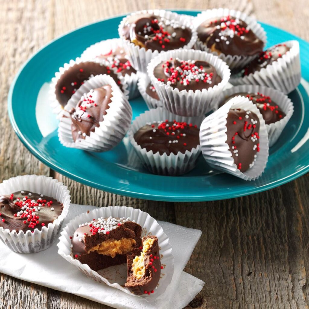 Homemade peanut butter cups in mini liners as homemade Christmas treats for gifts